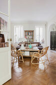 View through open double doors into living room with herringbone parquet floor