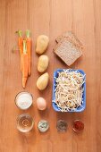 Ingredients for potato and carrot fritters with bean sprouts
