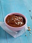 Banana and chocolate pudding with peanuts