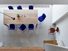 View down onto dining area with blue upholstered chairs