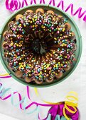 A gugelhupf with a chocolate glaze and sugar confetti for a carnival