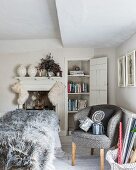 Furry Christmas stockings hung from fireplace in grey and white bedroom