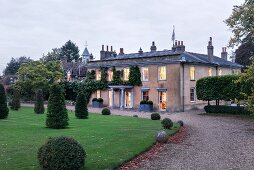 Old English manor house with drive and gardens