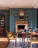 Antique furniture in classic dining room with panelled walls