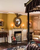 Traditional bedroom with two-tone walls and fireplace