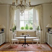 Baroque furniture in living room with lattice window