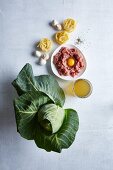 Ingredients for meatballs on pointed cabbage tagliatelle