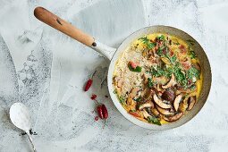 A mushroom omelette with tomato and chilli