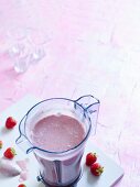 Strawberry Dream with banana, chia seeds and coconut milk in a mixer