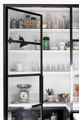 Glass-steel door to the pantry with built-in shelves