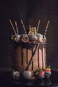 Sweet chocolate cake served on the wooden background