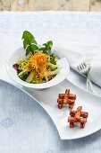 Celery and dandelion salad with fried tofu strips