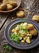 Falafel biscuits with salsa and a cashew and potato salad