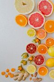 Various citrus fruits on a white background (seen from above)