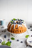 Sponge cake with blueberries and icing