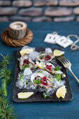 Oysters with pomegranate seeds and lemon for Christmas