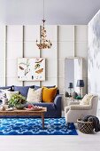 Living room in blue and white with wall covering made of decorative strips