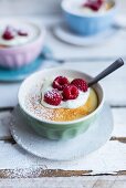 Lemon pudding with raspberries