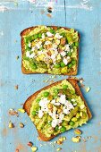 Wholemeal bread with broad bean spread, asparagus, peas and feta