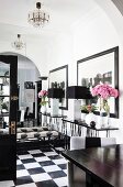 Mirrored wall in black and white foyer