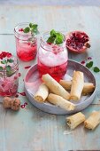 Pomegranate spritz served with feta rolls in flaky pastry