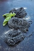 Homemade squid ink spaghetti with basil