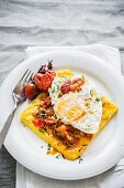 Grilled polenta with tomato sauce and a fried egg