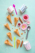 Ice cream cones, containers and sprinkles for ice cream