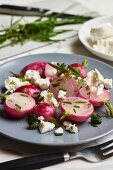 Stewed radishes with herbs and sheep's cheese