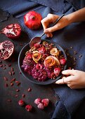 A smoothie bowl with beetroot chia pudding and quinoa muesli