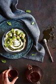 A smoothie bowl with vanilla labneh, and moringa and mint syrup