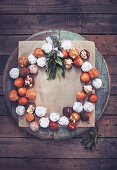 Doughnut balls with different glazes arranged in a wreath