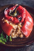 Red peppers stuffed with rice and meat (close-up)