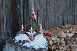 Pyramid Advent arrangement made from apples and box twigs