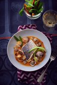 Sea bass and clams in tomato sauce