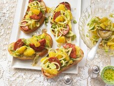 Orange and fennel salad with spicy salami slices on ciabatta bread