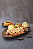 Prawn skewers with pepper salsa and avocado salad