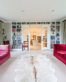 Lattice door framed by bookshelves in living room