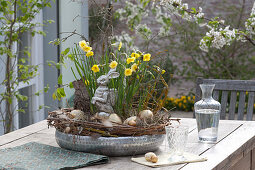 Silver bowl with narcissus, easter bunny and easter eggs