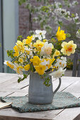 Bouquet of mixed Narcissus, common hornbeam branches