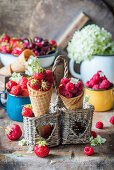 Strawberries and raspberries in ice cream cones