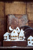Iced gingerbread houses decorated with almonds