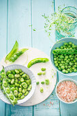 An arrangement of fresh fava beans and peas