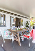 Festive table with concrete slab on the veranda