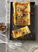 Potato and pumpkin tart with gorgonzola and caramelised cashew nuts
