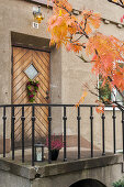 Autumnal wreath on front door of house