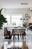 View from kitchen into dining area with large window