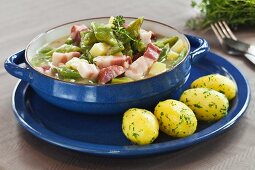 Bean stew with bacon and parsley potatoes