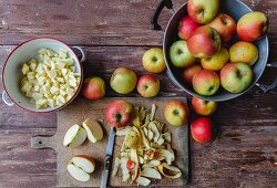 Fresh apples, whole and sliced, for an apple cake