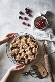 Gluten-free cherry pie with shortcrust pastry stars on a wire cooling rack